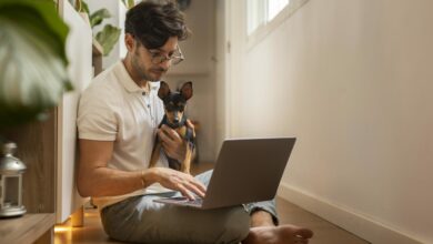 person working from home with pet dog scaled 1 1
